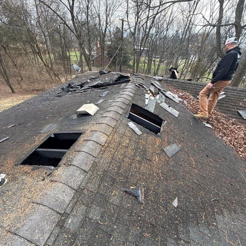Shingle roof with hail damage and missing sections