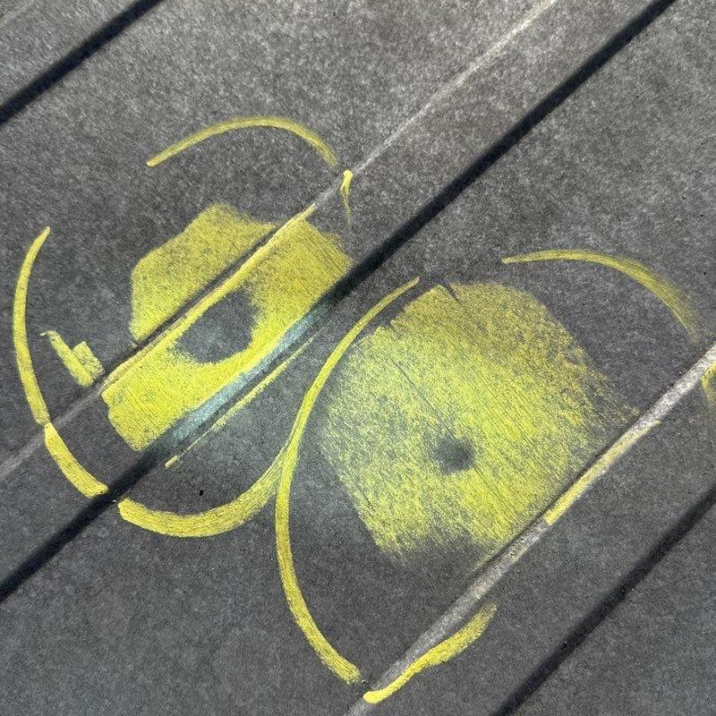 Commercial metal roofing hail damage marked for repair