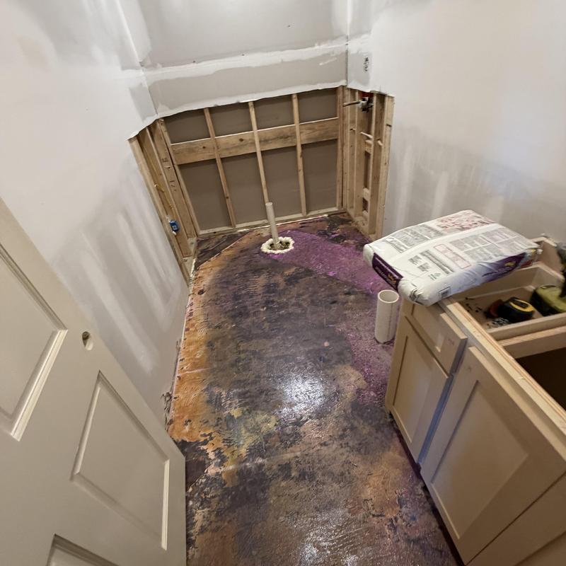 Bathroom floor subfloor prep with self-leveler materials
