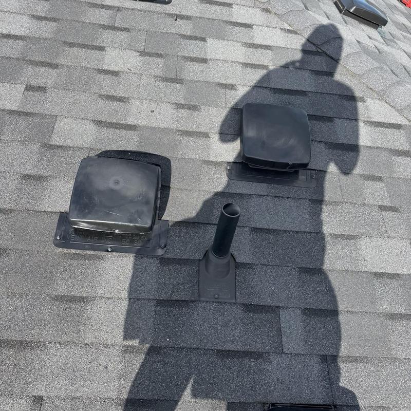 Flapper vents and pipe boots on asphalt roof shingles