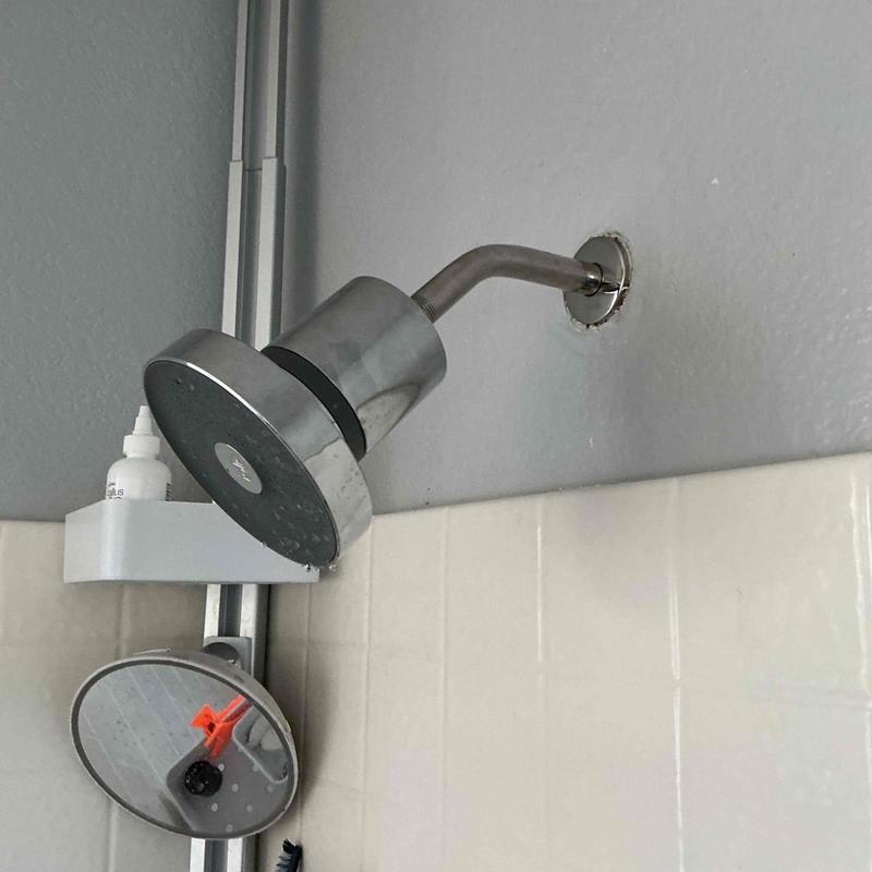 Shower arm and shower head installation in bathroom Shower arm and shower head installation in bathroom