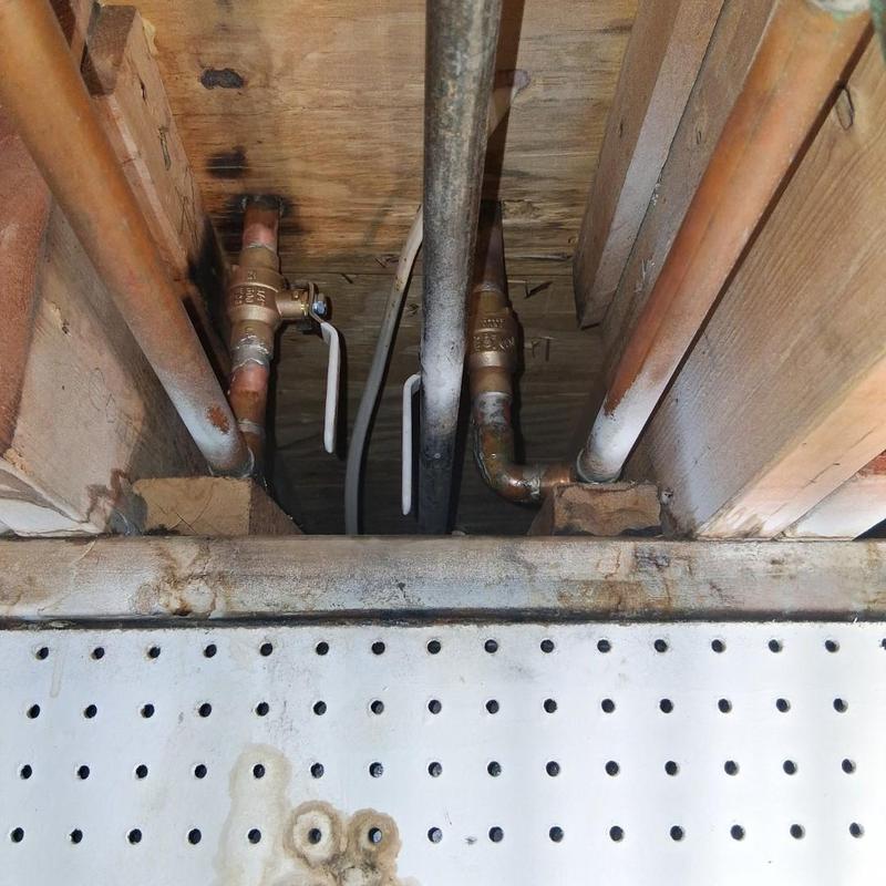 Gate valves on copper plumbing pipes below floor joists