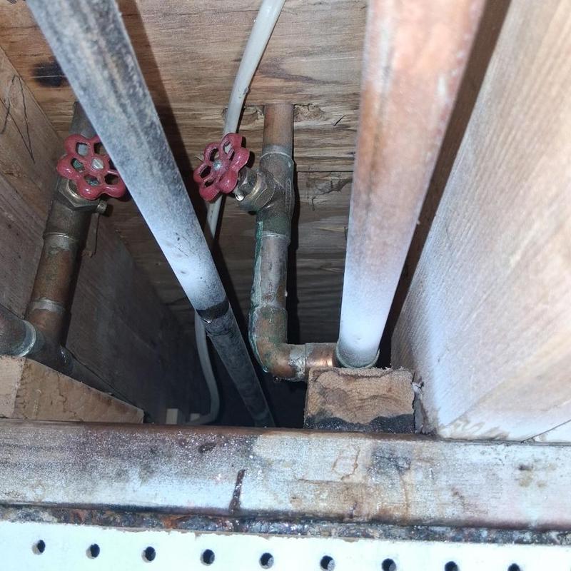 Gate valves with copper piping in ceiling cavity