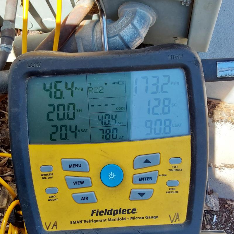 Carrier AC refrigerant manifold gauge displaying pressure readings