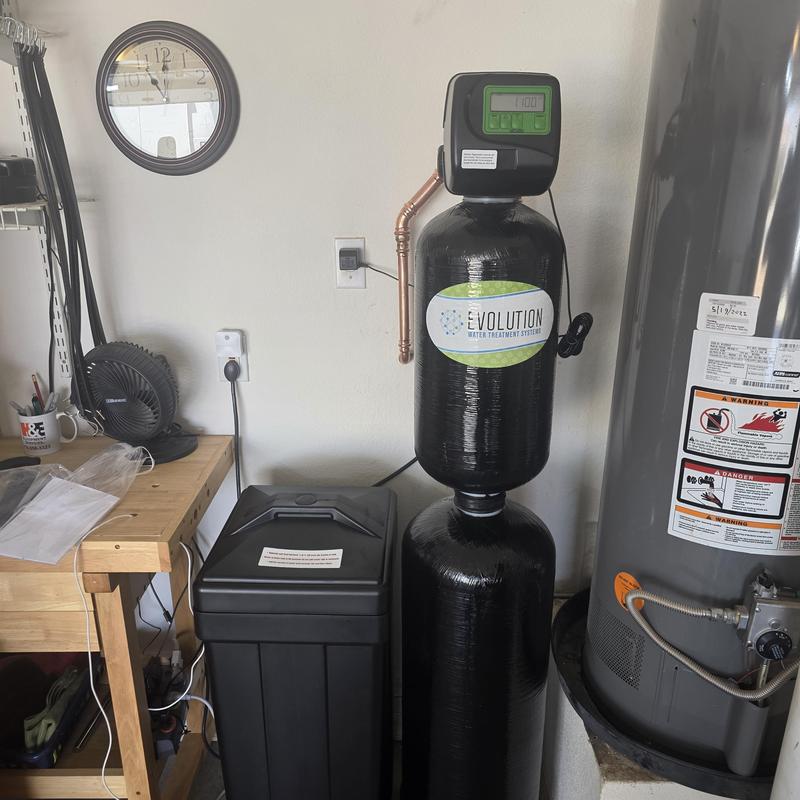 Water softener with filtration system installation in garage Water softener with filtration system installation in garage