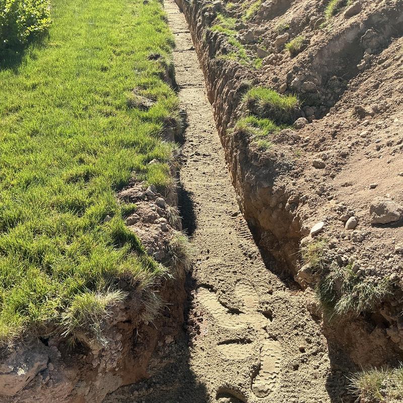 Gas line trench excavation for firepit installation Gas line trench excavation for firepit installation