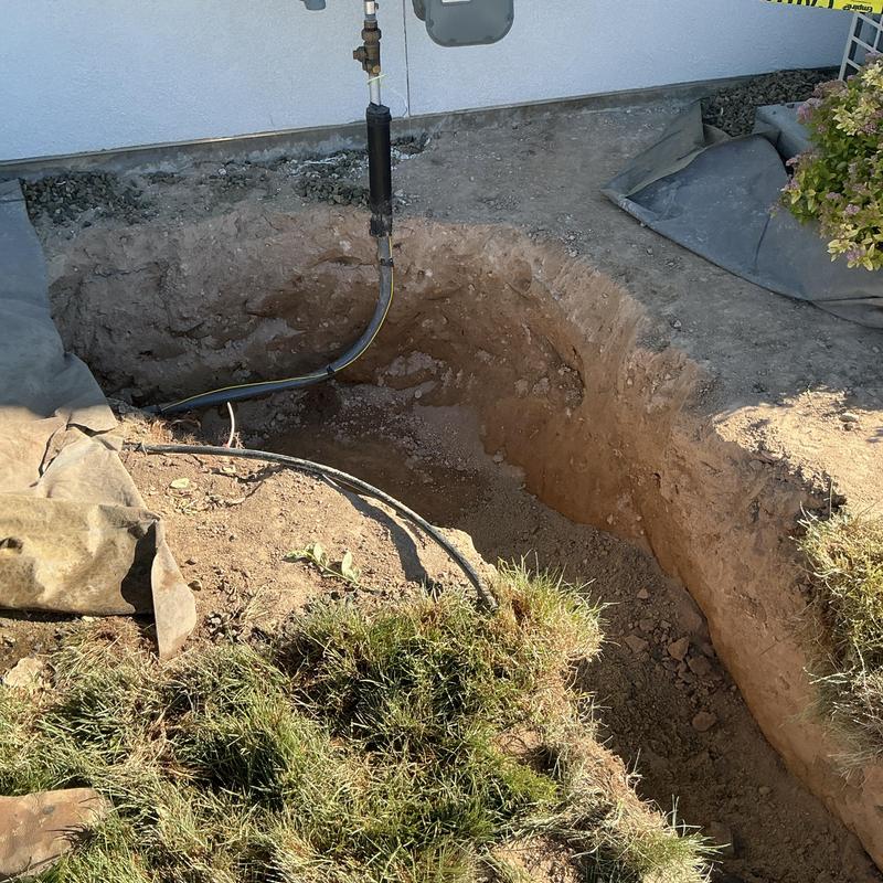 Gas line installation trench beside house wall Gas line installation trench beside house wall