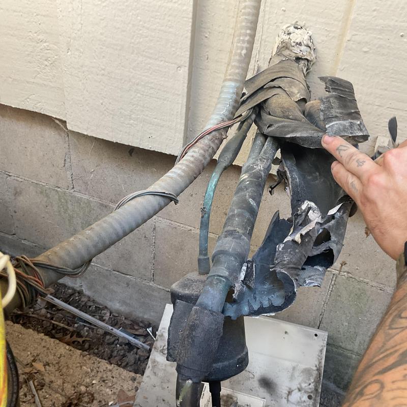 R22 refrigerant line with damaged insulation and leaks