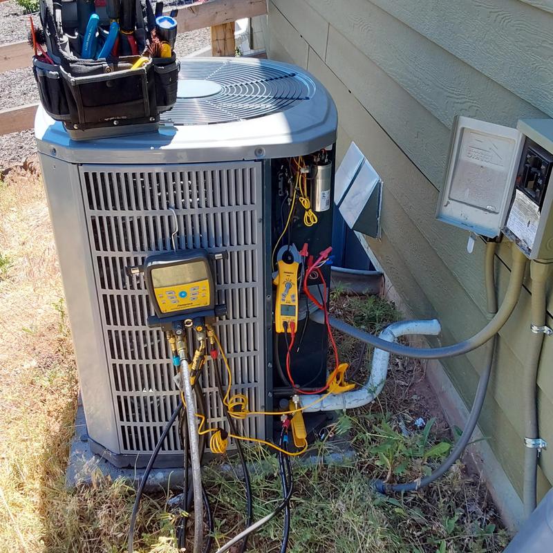 American Standard air conditioner with diagnostic tools attached