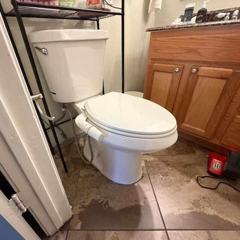 Toilet with secured flange and new wax ring
