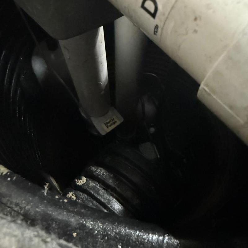 Sump pump discharge pipe inside basin