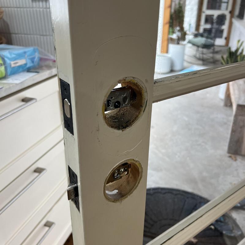 House door knob and deadbolt holes before installation