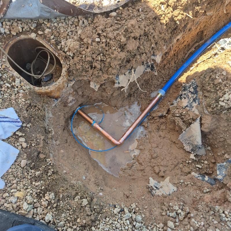 Main water service repipe with copper and blue pipe