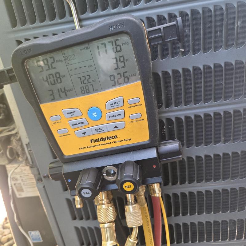 HVAC system manifold gauge measuring refrigerant pressure HVAC system manifold gauge measuring refrigerant pressure