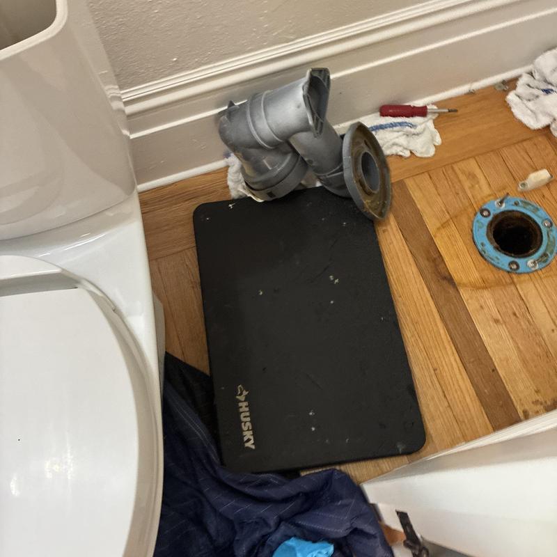 Toilet flange and waste pipe reset on hardwood floor