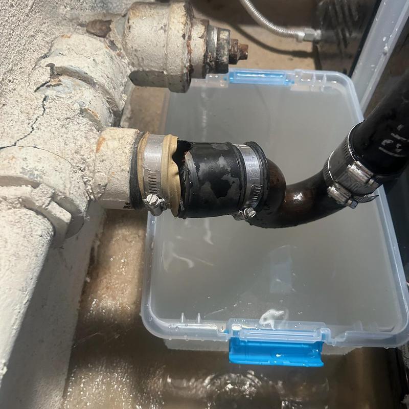 Washing machine drain line with damaged Fernco coupling