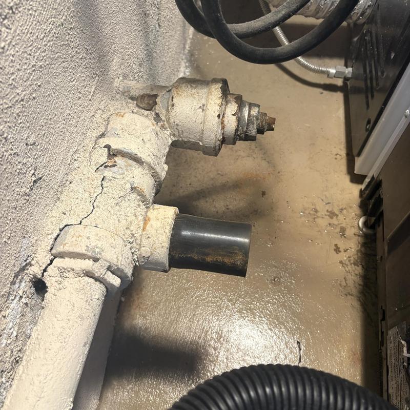 Washing machine drain pipe with corroded fitting