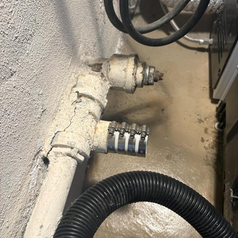 Washing machine drain pipe with hose clamps installed
