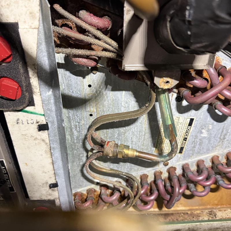 Evaporator coil refrigerant line with leak signs Evaporator coil refrigerant line with leak signs