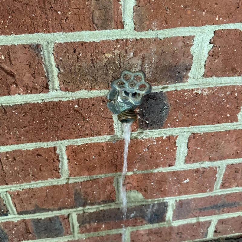 Frost proof hose bib leaking water on brick wall Frost proof hose bib leaking water on brick wall