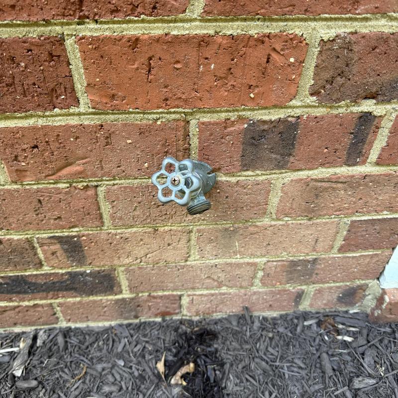 Frost proof hose bib with shut off valve on brick wall Frost proof hose bib with shut off valve on brick wall
