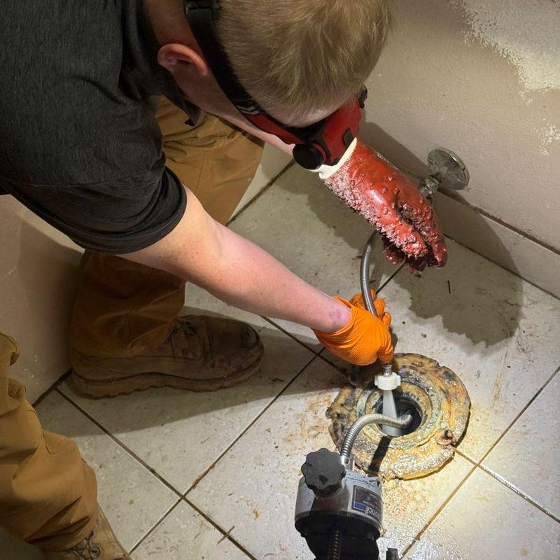Floor drain cleaning with mechanical drain snake