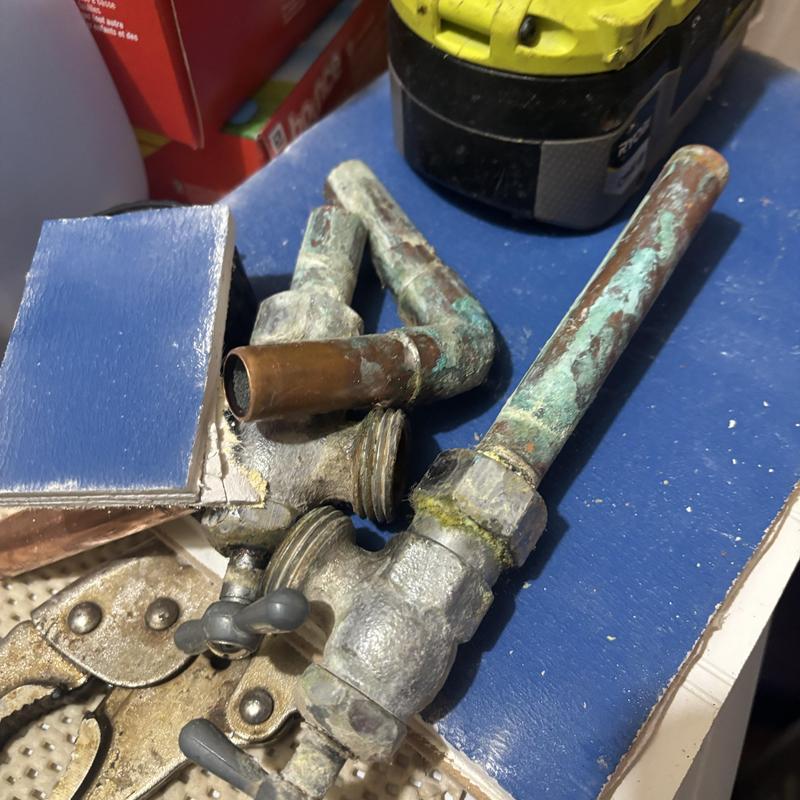 Laundry water valves with heavy corrosion and drain pipe parts