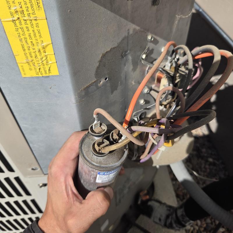 HVAC capacitor with wiring during inspection HVAC capacitor with wiring during inspection