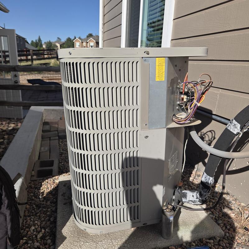 Air conditioner condenser unit with exposed wiring panel Air conditioner condenser unit with exposed wiring panel