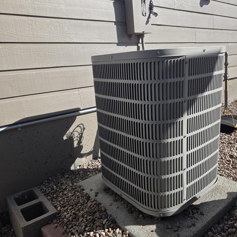Outdoor air conditioning condenser unit on gravel bed Outdoor air conditioning condenser unit on gravel bed
