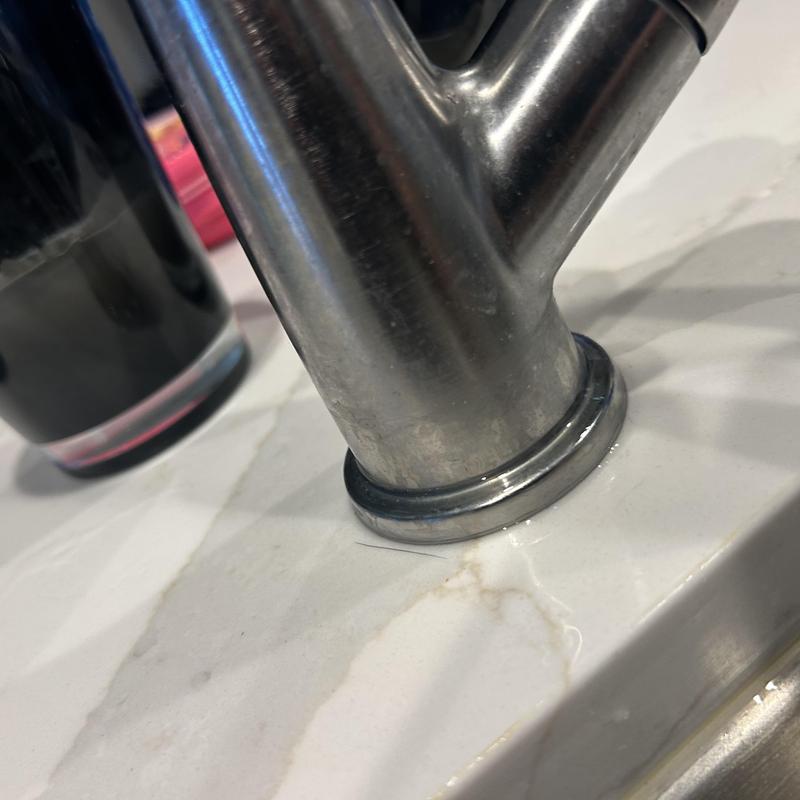 Delta faucet base with water leak on countertop Delta faucet base with water leak on countertop