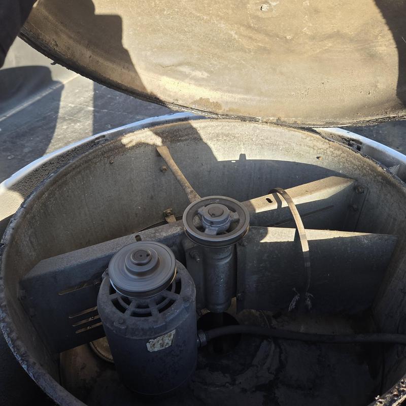 Cooling tower fan motor and blades inside housing Cooling tower fan motor and blades inside housing