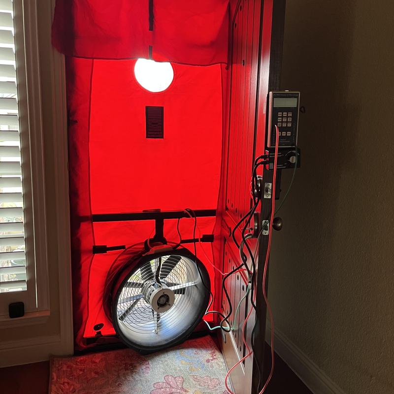 Blower door fan setup for home energy audit