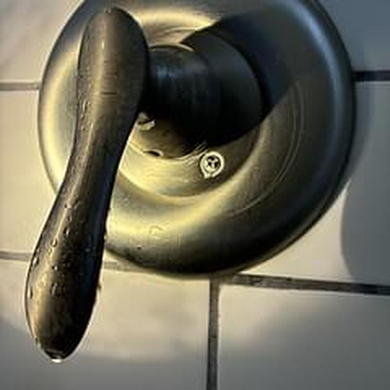 Shower valve handle and cover plate removed, dripping Shower valve handle and cover plate removed, dripping