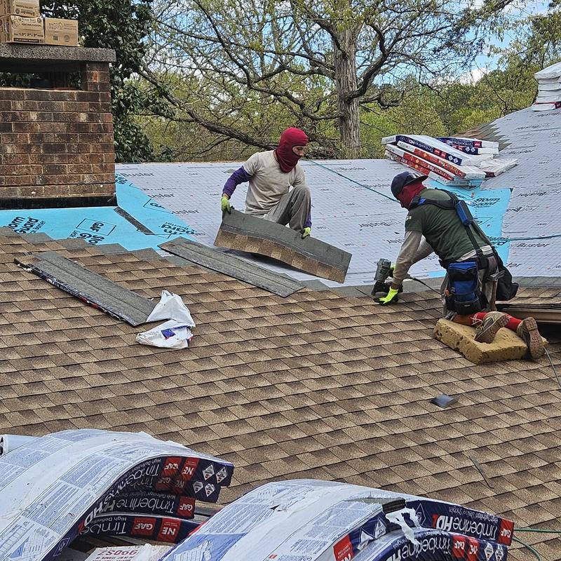Architectural shingle roofing installation on residential roof Architectural shingle roofing installation on residential roof