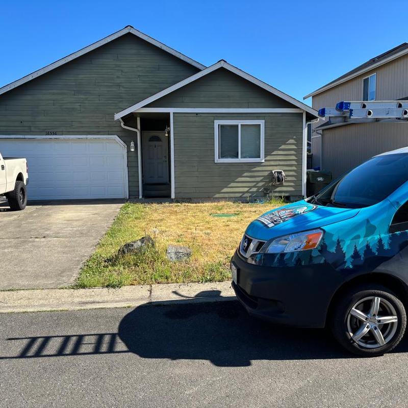 Residential roof exterior with service van and ladder shadow Residential roof exterior with service van and ladder shadow