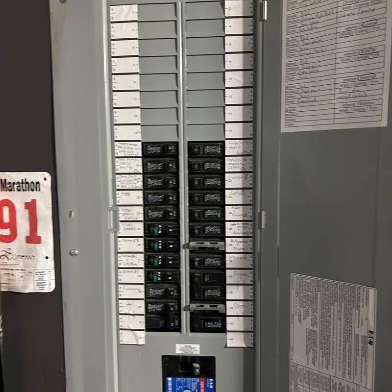 Electrical breaker panel with labeled circuits in home Electrical breaker panel with labeled circuits in home