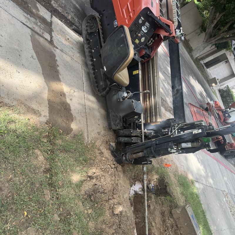 Directional drilling machine installing water line service Directional drilling machine installing water line service