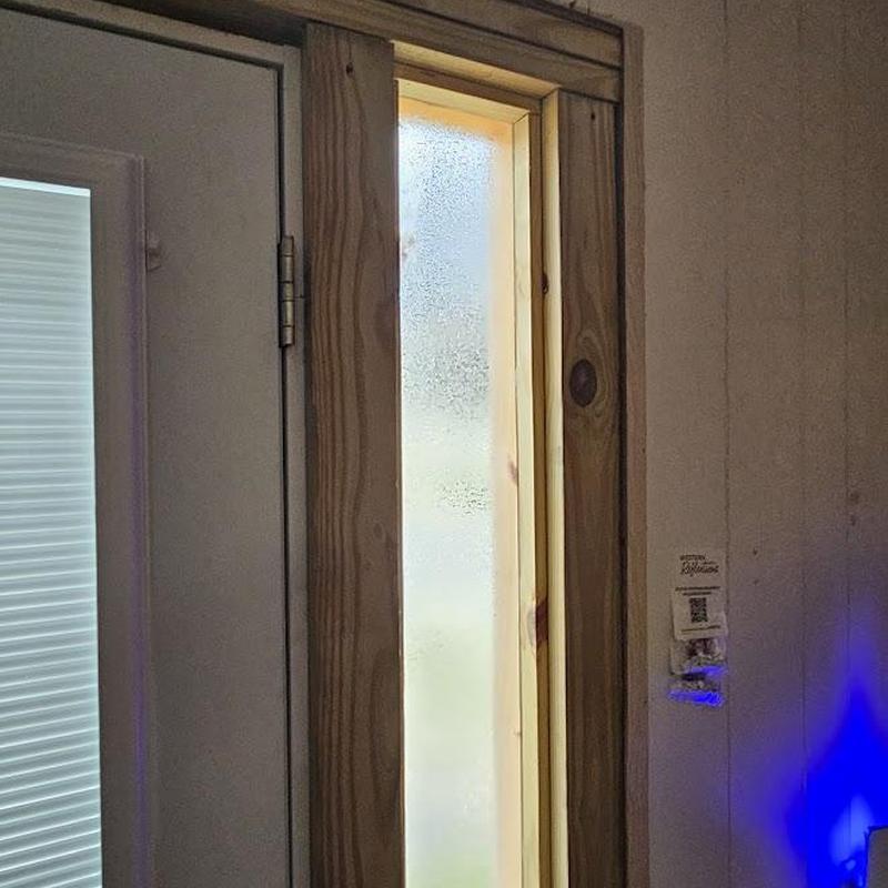 Narrow frosted window with wood trim installation Narrow frosted window with wood trim installation