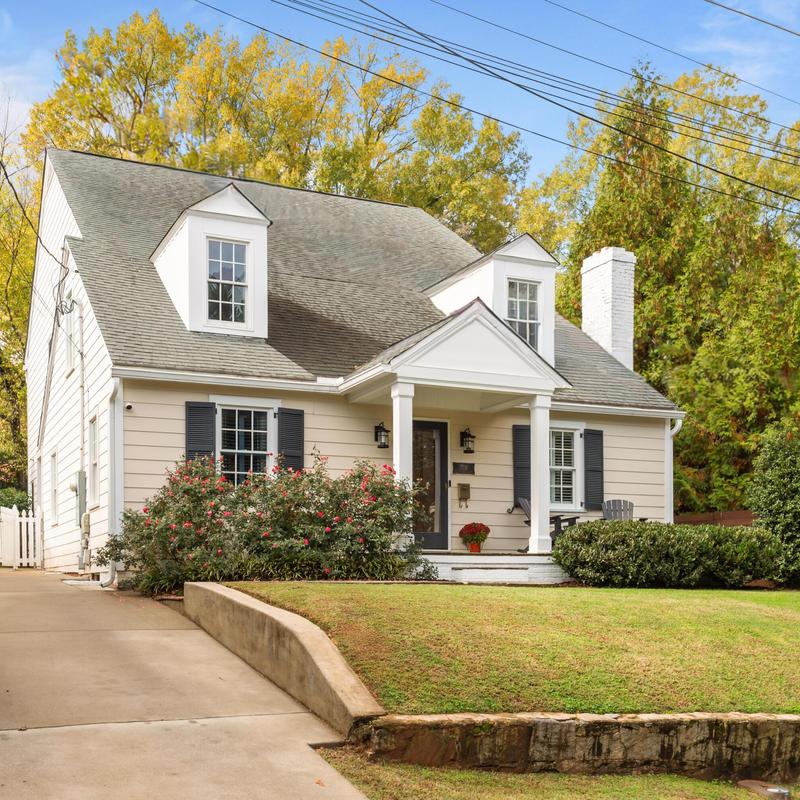Roof with dormer windows on suburban home in fall Roof with dormer windows on suburban home in fall