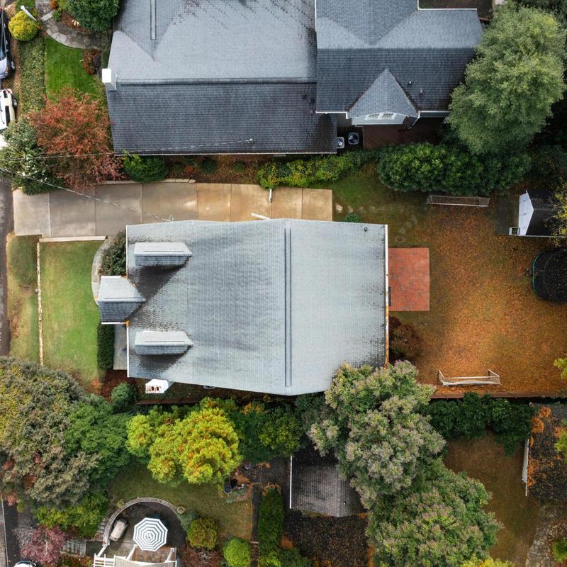 Asphalt shingle roof with surrounding yard and driveway Asphalt shingle roof with surrounding yard and driveway