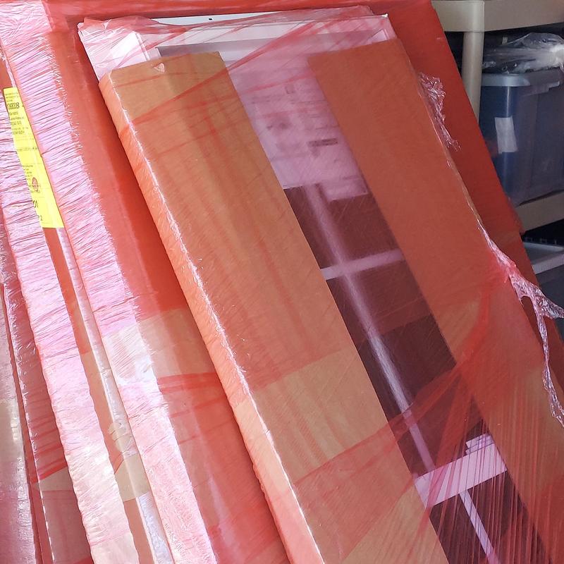 Window units wrapped in protective orange plastic Window units wrapped in protective orange plastic