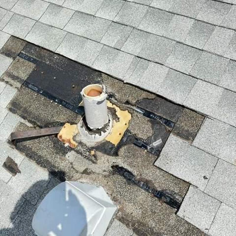 Roof vent boot with damaged shingles on shingle roof Roof vent boot with damaged shingles on shingle roof
