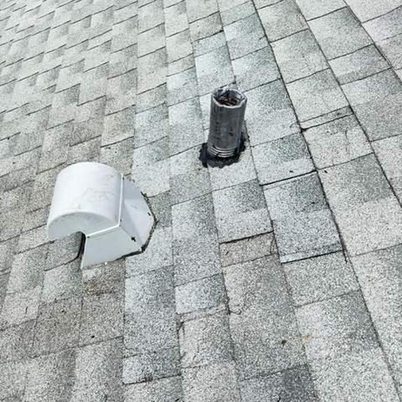 Shingle roof vent boot with damaged flashing Shingle roof vent boot with damaged flashing