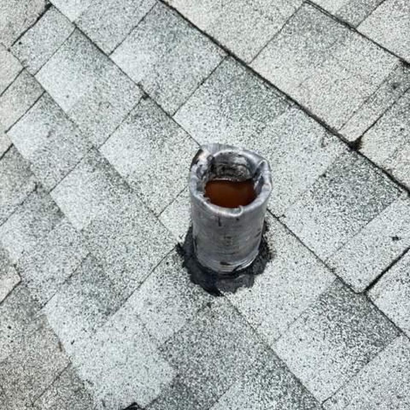 Plumbing vent pipe boot on shingle roof before replacement Plumbing vent pipe boot on shingle roof before replacement