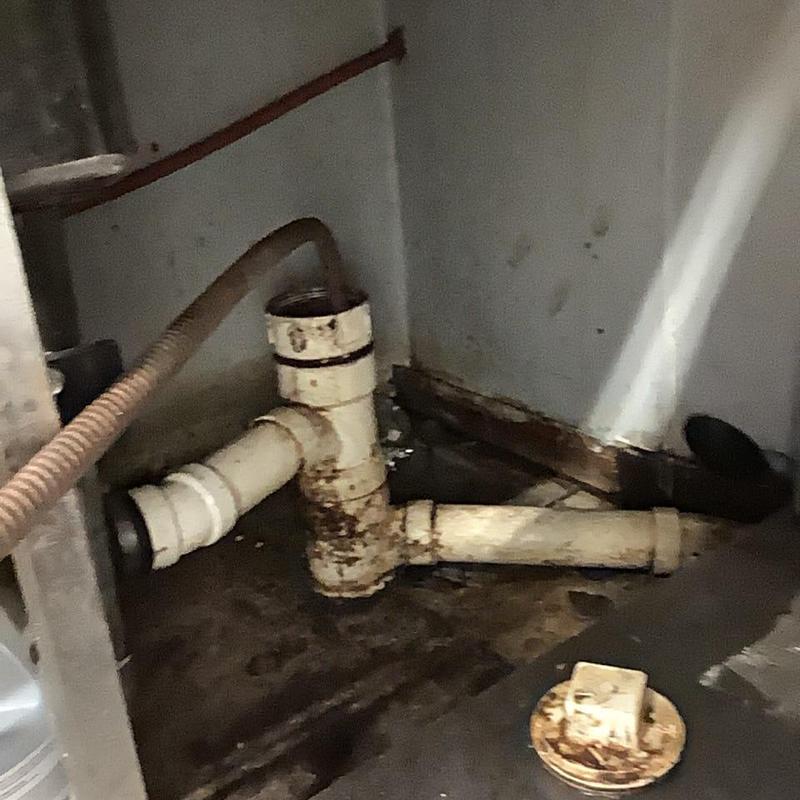 Main sewer line pipe with cleaning cable inserted Main sewer line pipe with cleaning cable inserted