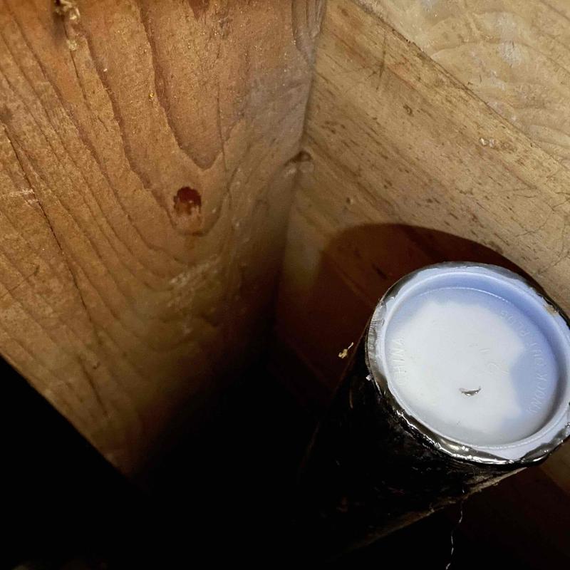 Galvanized sink drain pipe capped under floorboards Galvanized sink drain pipe capped under floorboards