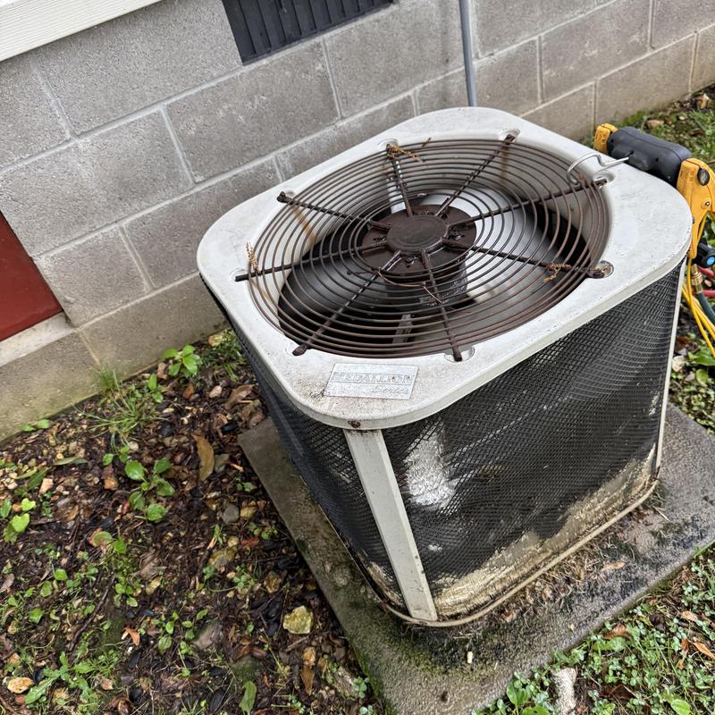 Bent outdoor air conditioner condenser coil with damaged fan grill Bent outdoor air conditioner condenser coil with damaged fan grill