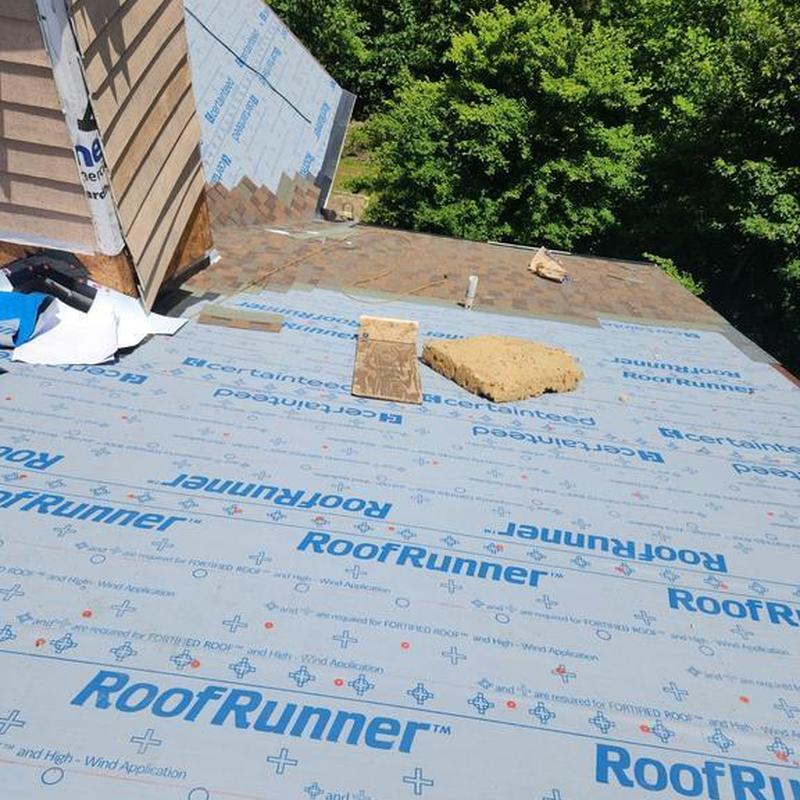 Roof underlayment installation with chimney siding replacement