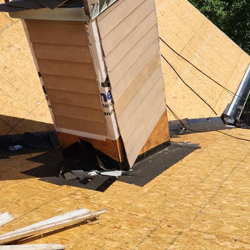 Chimney wood siding replacement on roof deck